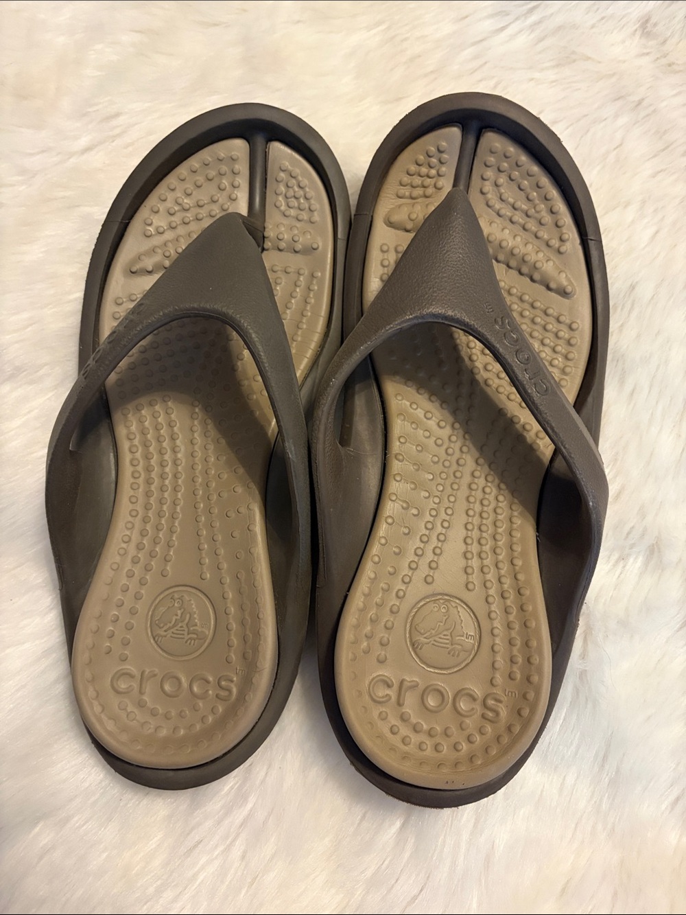 Crocs brand men’s size 5 women’s size 7 brown, and tan flip-flops